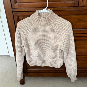 Cream colored turtleneck sweater